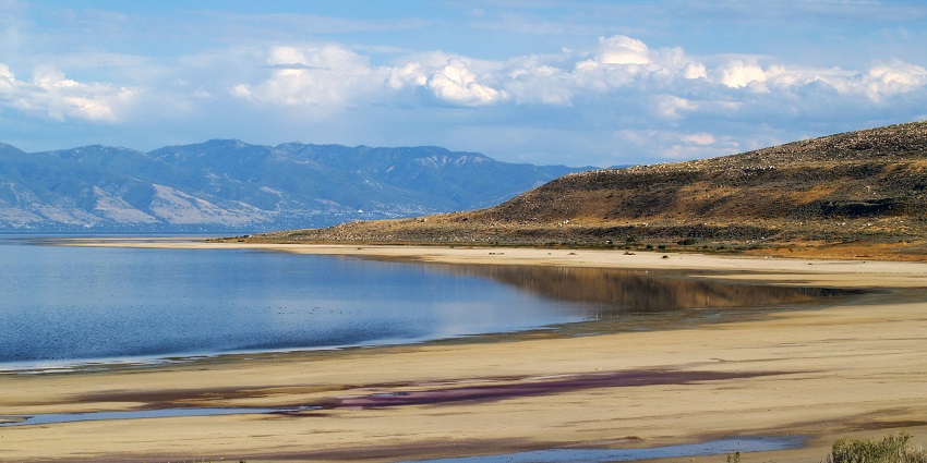 View of the Great Salt Lake with vast blue waters and distant mountain views