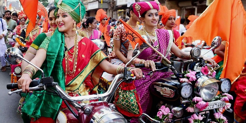 An image of people celebrating a festival on the streets, enjoying one of the crop festivals.