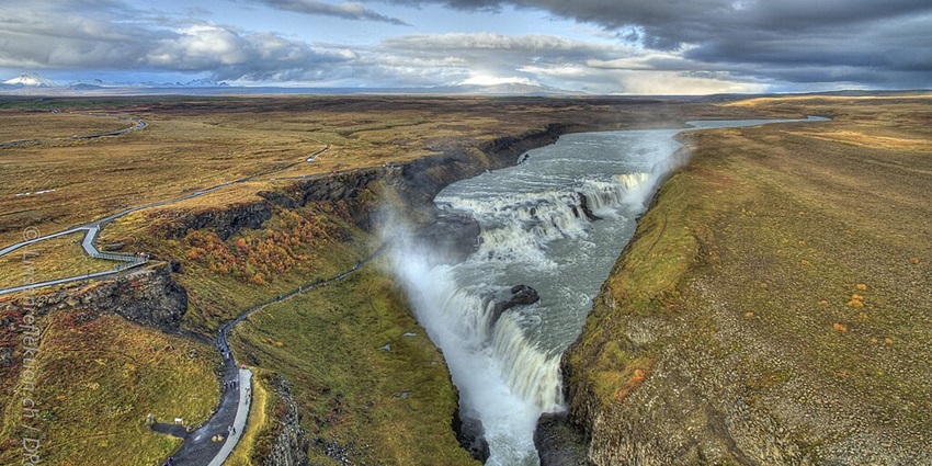 Aerial view of Gullfoss waterfall showcasing its powerful cascades and scenic vistas.