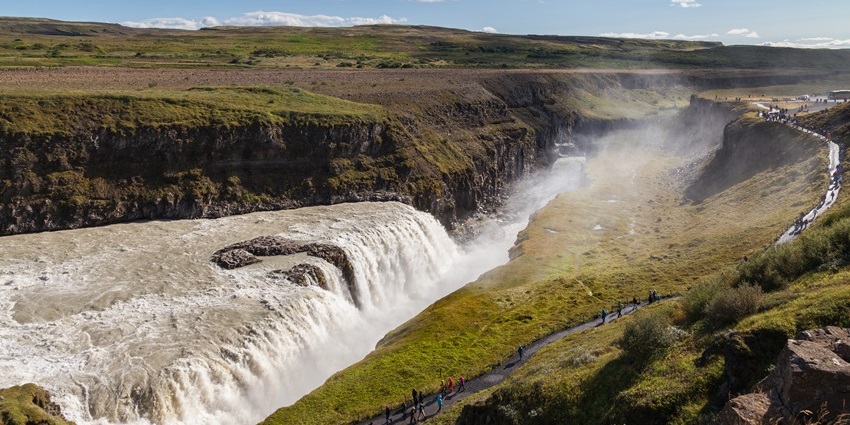 Experience the Golden Falls of Iceland, a spectacular two-tiered waterfall on the Hvítá River.