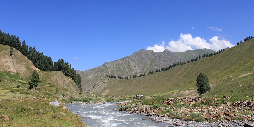 Gurez valley with a small river flowing through the valley, mountains, rocks and greenery
