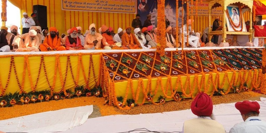 An image of devotees taking a procession at Rajasthan during Guru Ravidas Jayanti festival.
