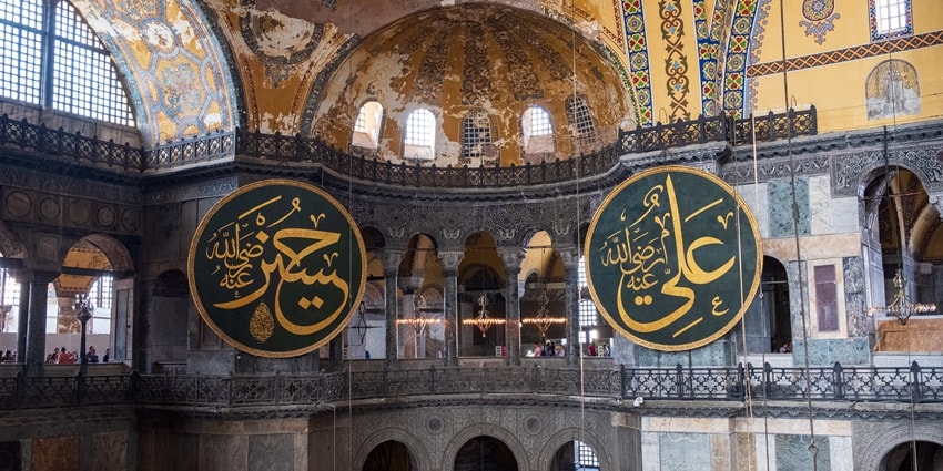 Photo of Hagia Sophia, featuring its colossal dome and ornate interiors.