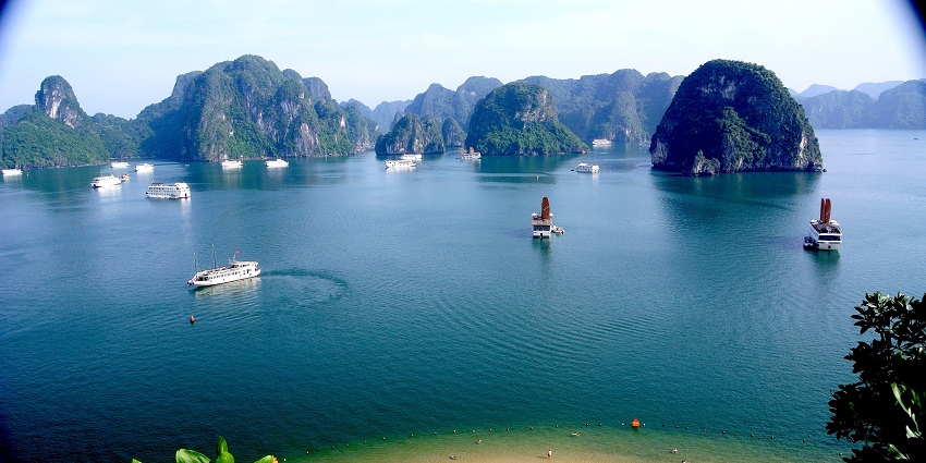 An image showing Halong Bay with limestone islands and clear waters in Vietnam.