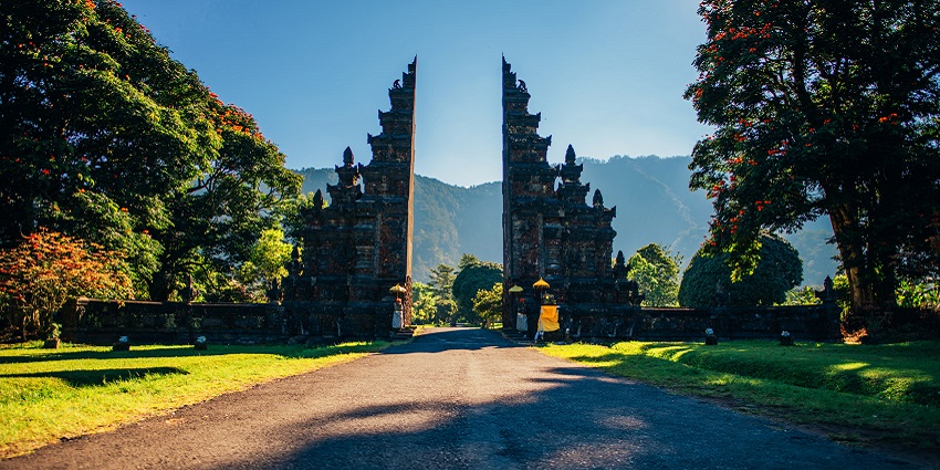 Capture a picture-perfect moment at Bali’s famous Handara Gate with misty mountains
