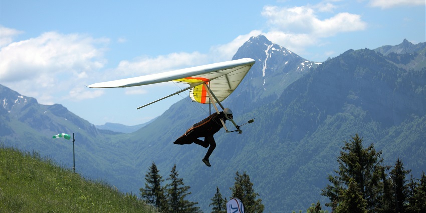 Indulge in hang gliding, one sport among the popular adventure sports that you must experience.
