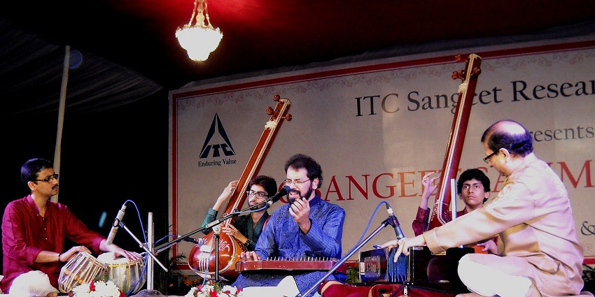 An image of classical musicians performing at the Harballabh Sangeet Sammelan in Jalandhar, India.