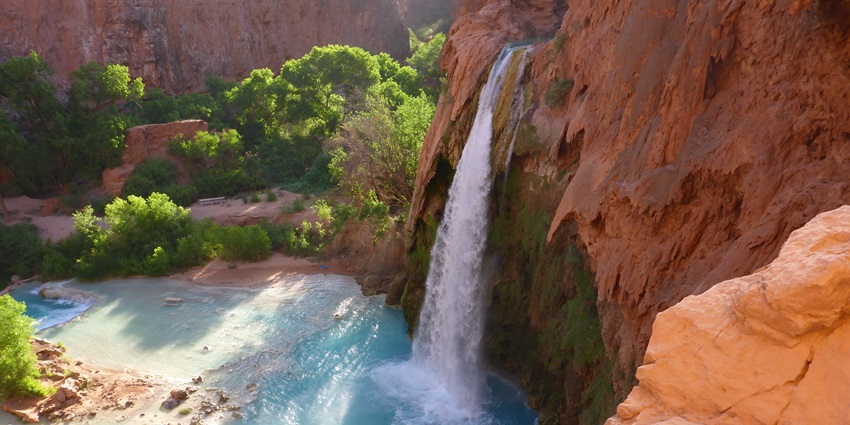 A mesmerising blue-green waterfall in America within the Grand Canyon, accessible via a challenging hike.