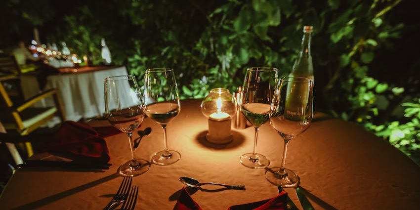 An image of candlelit dinner which is one of the best things to do in Couples.
