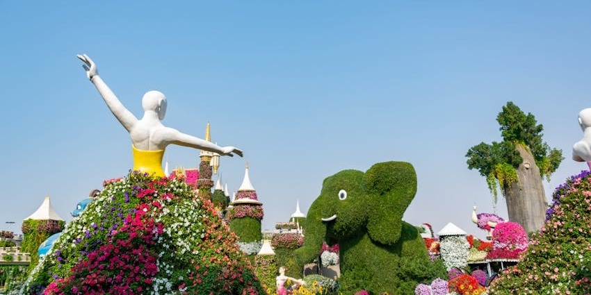 A romantic floral tunnel forming a heart-shaped walkway with colorful blossoms
