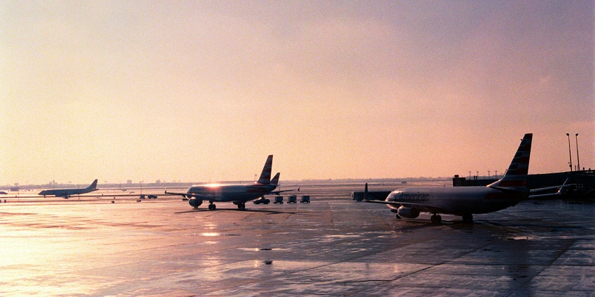 Aerial view of London Heathrow Airport with runways, terminals, and parked aircraft.