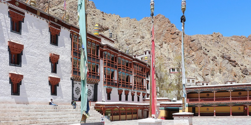 Hemis monastery with traditional Tibetan architecture and rocky mountains in the back