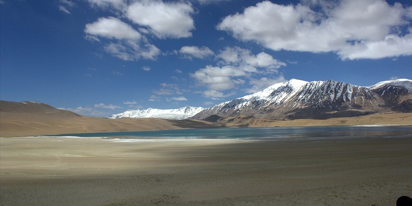 A glimpse of majestic mountains laden with snow and rustic trails of Hemis National Park.