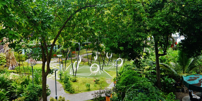Scenic walking trails through the lush greenery of Henveiru Park, near Male Friday Mosque.