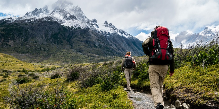 A view of people trekking through the rugged terrains of Pidurangala Rock, Sri Lanka.