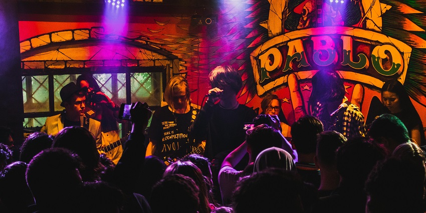 Image of a vibrant party atmosphere at Hip Strip, one of the best nightlife spots in Jamaica.
