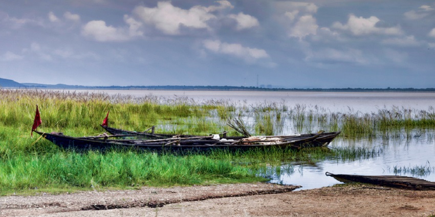 An image of Hirakud Dam Reservoir, a lake in Odisha, with vast blue waters and a scenic landscape.