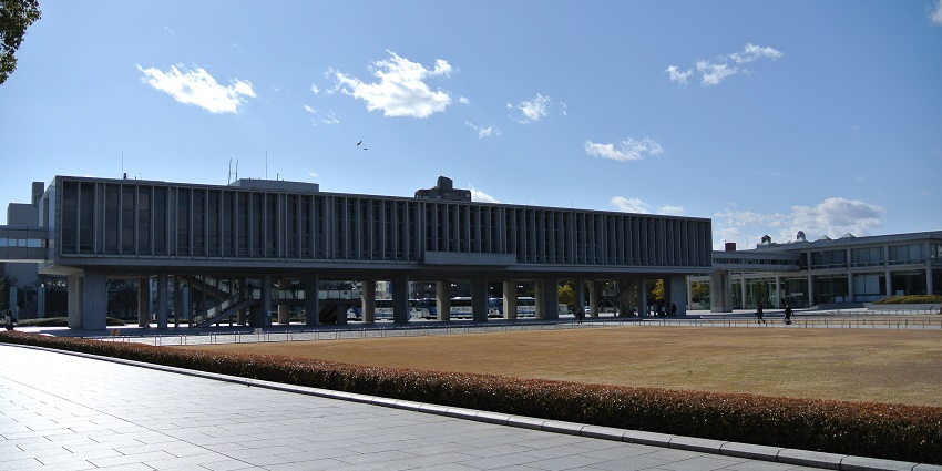 A rectangular building elevated on pillars of the Hiroshima Peace Memorial Museum.