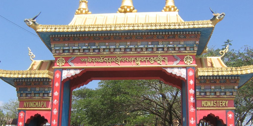 Structure of Namdroling Nyingmapa Monastery with traditional architectural elements.