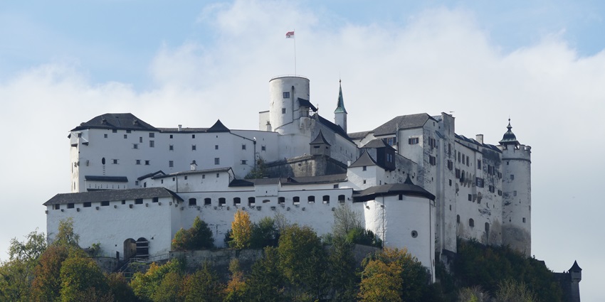 The majestic Hohensalzburg Fortress situated on a hill overlooking the city of Salzburg