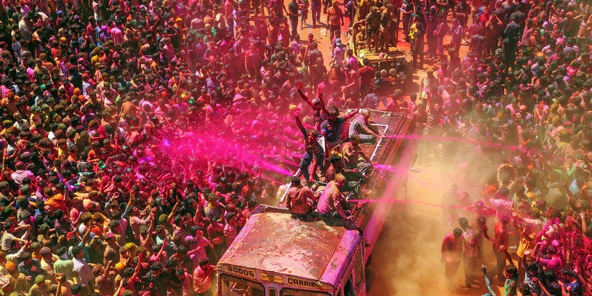 View of people celebrating Holi with vibrant colours and joyful gatherings