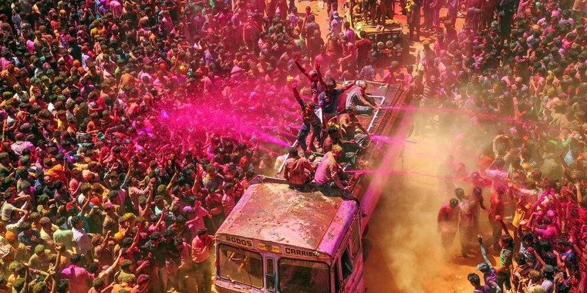 A large crowd celebrating Holi, one of the most important international festivals in India