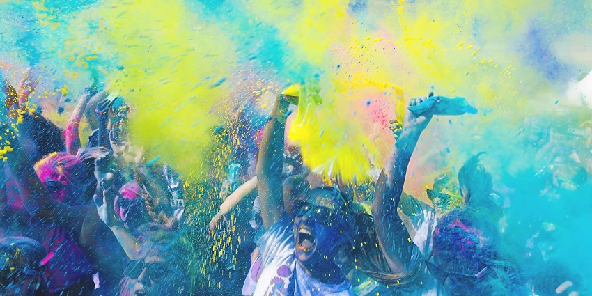 A shop displays vibrant colored powders for Holi in India, the festival of colors and joy.