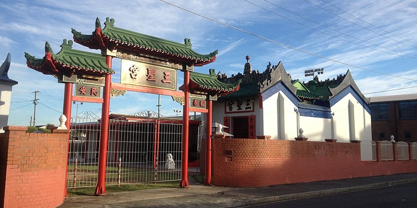 Holy triad temple with an entrance gate structure, one of the buddhist temples in Australia.