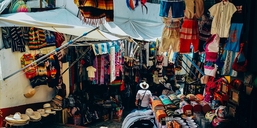 An image of a clothing market with a variety of material similar to the Hong Kong Market