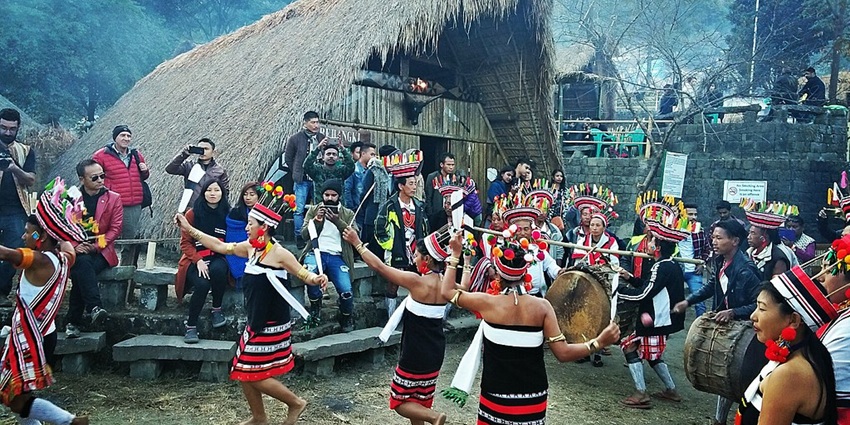 An image of a group of people celebrating the Hornbill Festival, a popular festival in winter in India