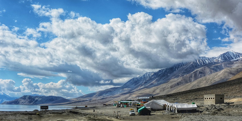 The image of Pangong Tso Lake and tents of travellers - that will convince you to plan a trip