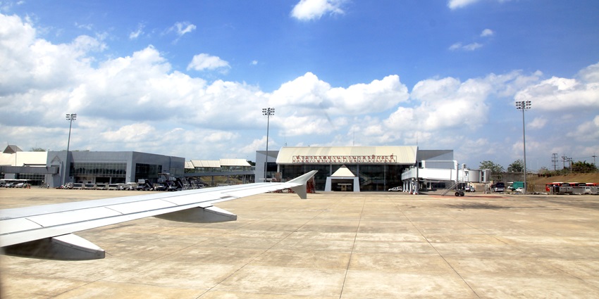 The grand entrance of Krabi International Airport, featuring signage and trees nearby
