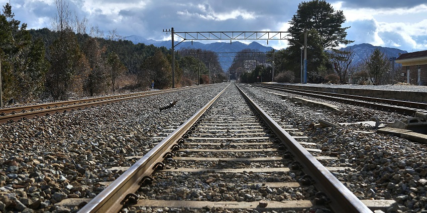Railway tracks stretching toward distant hills, an offbeat route in Mihintale travel guide