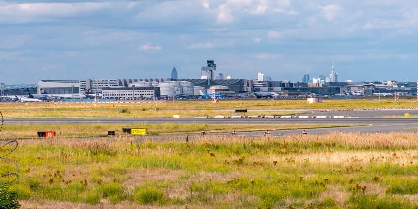 Frankfurt Airport view with city skyline, a key hub featured in any Europe travel guide.