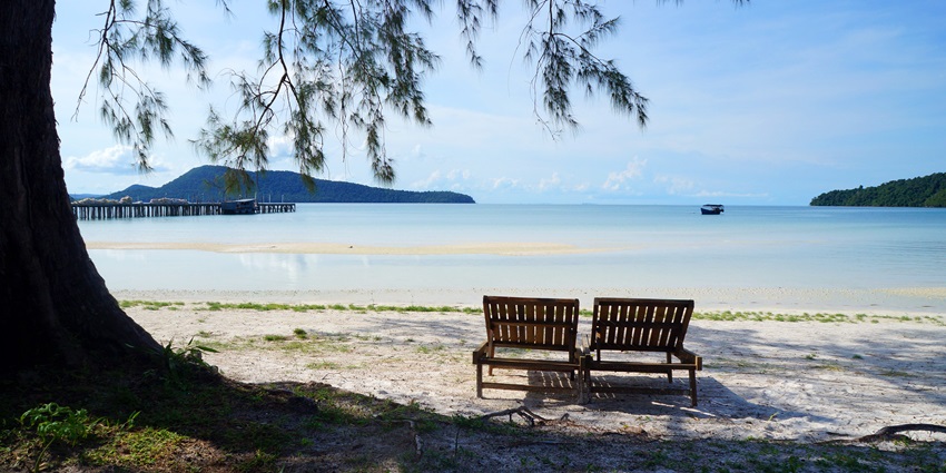 An image showing a couple of benches on the paradise beach of Koh Rong Sanloem in Koh Rong, Cambodia