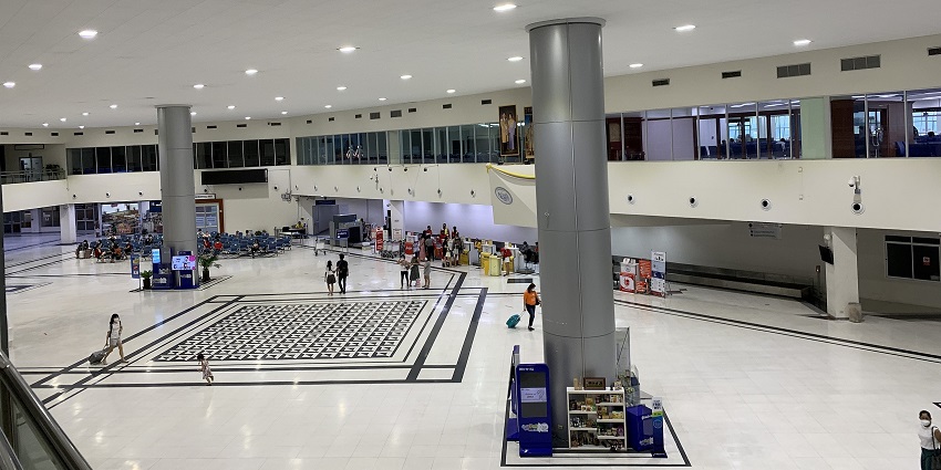 Phitsanulok Airport terminal with seating areas and travellers waiting for flights.