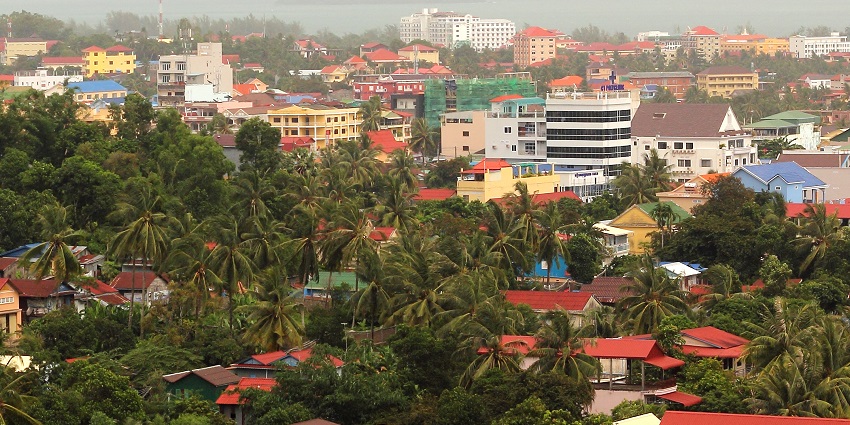 A wide view of Sihanoukville, including its urban areas, with buildings and houses.