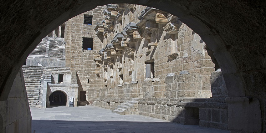 A picture of a tourist group heading toward the entrance of Aspendos Theatre.