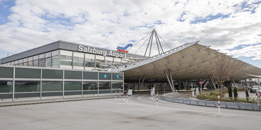 An image showing the aerial view of Salzburg Airport, surrounded by mountains