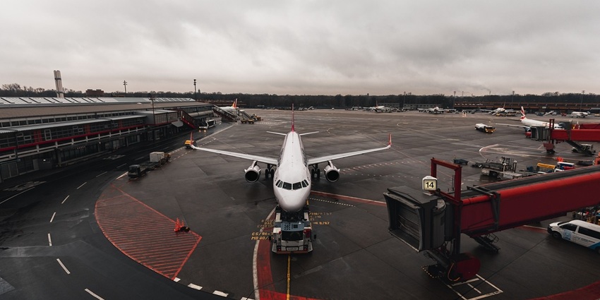 An image of an airport showing aeroplanes resembling the Mumbai Airport, Maharashtra.