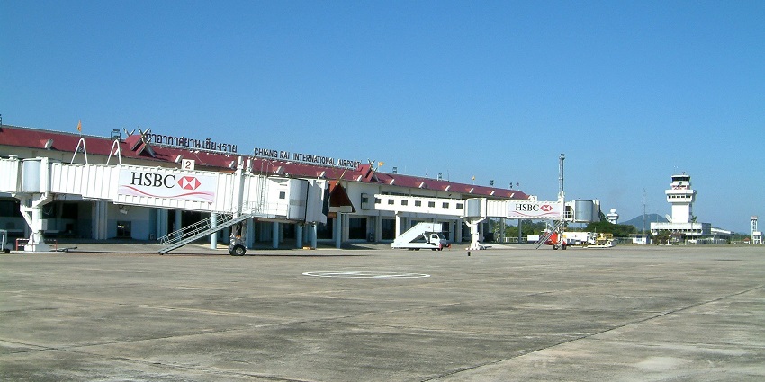 Chiang Rai International Airport in Thailand, with modern buildings and clear blue skies.