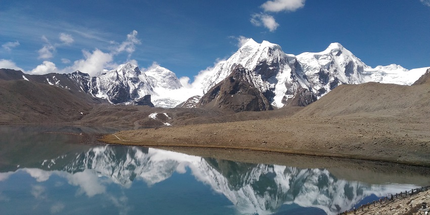 Scenic view of the Green lake trek, encircled by the majestic snow covered Himalayan ranges