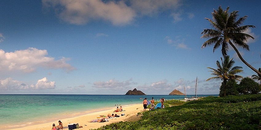 An image showing the pristine Lanikai Beach, Hawaii, with turquoise waters and soft sand.