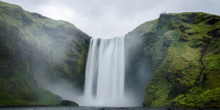 Ravana Falls in Sri Lanka, a stunning natural attraction with a serene pool at its base.