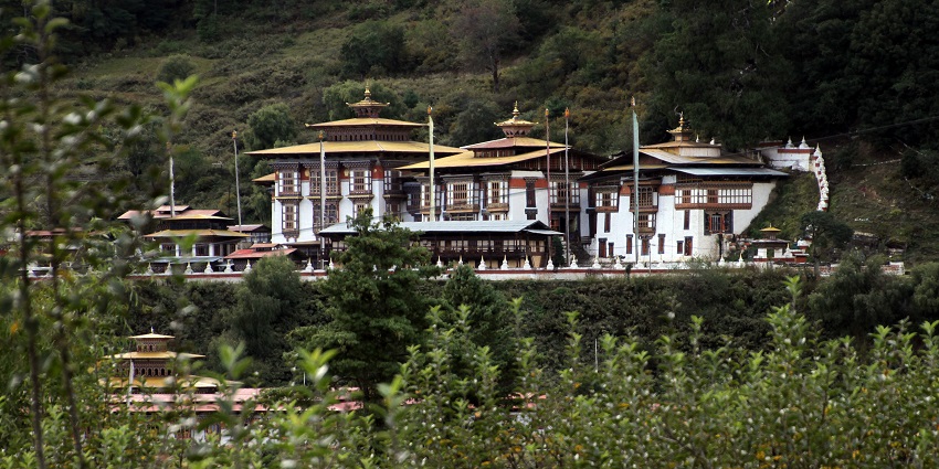 View of the Kurjey Lhakhang in Bumthang Bhutan, surrounded by lush greenery