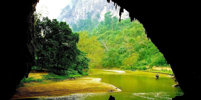 The stunning interior of Hua Ma Cave is illuminated to reveal intricate stalactites and stalagmites