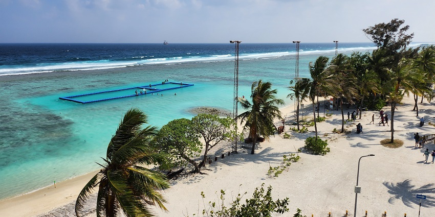Modern island with sandy beaches, vibrant cafes, and scenic oceanfront promenades