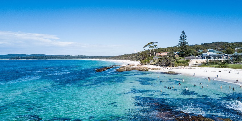 Panoramic view of the Hyams Beach shows the surrounding greenery and pleasant views, making it one of the best white sand beaches in the world.
