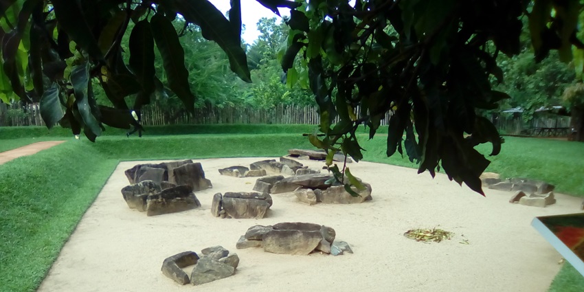 Stone burial chambers at the Ibbankatuwa Megalithic Tombs during the daytime.