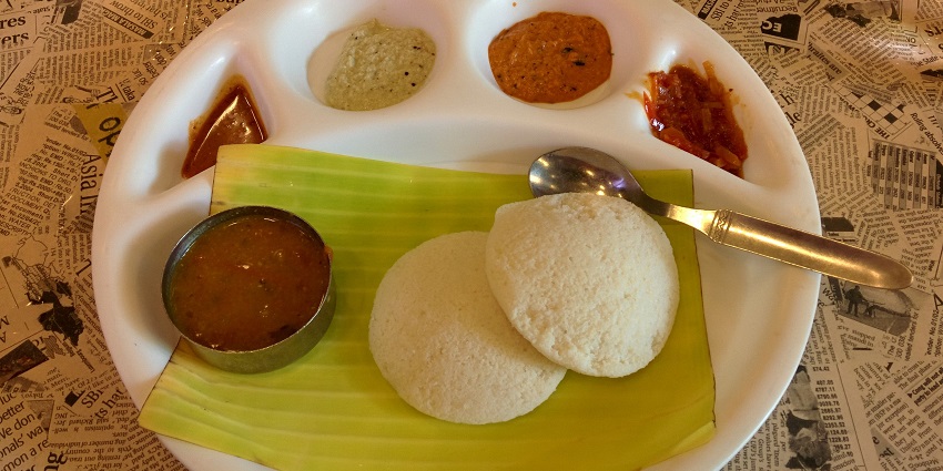 An image showing Idli with Sambar and Chutney, a popular South Indian breakfast dish.